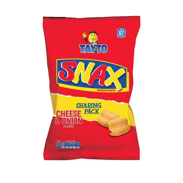 A bright red snack bag featuring Tayto Snax potato puffs in cheese and onion flavor, labeled as a sharing pack.