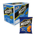 A McCoys Ridge Cut Salt and Vinegar box (36 x 45g packets) displays seaside-inspired design with ridged potato chips, bold white and gold text, and a 45g packet in front—both featuring the signature branding.