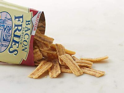 A packet of Smiths Bacon Fries 24 x 24g lies open on a white surface, crispy bacon flavour snack strips spilling out—an ideal vegetarian treat from Smiths for savoury snack lovers.
