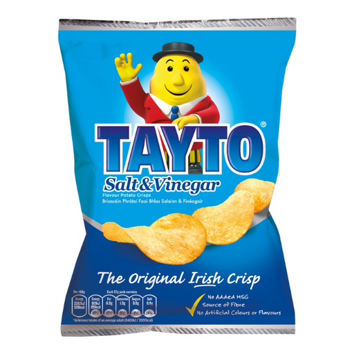Blue bag of Tayto Salt & Vinegar crisps featuring a smiling cartoon mascot in a suit. Tagline reads: "The Original Irish Crisp."