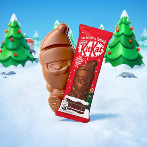 KitKat chocolate bar shaped like a Santa Claus figure with Christmas-themed packaging against a snowy background with trees.
