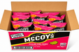 Packaging of McCoy's Ridge Cut Sizzling King Prawn flavor potato crisps with pink background