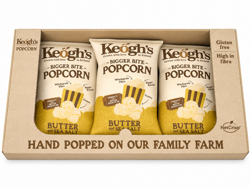 Three bags of Keoghs popcorn in a box with branding and product details.